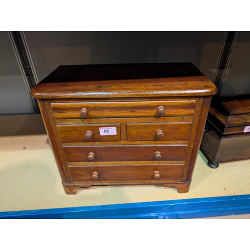 65 - A stained wood apprentice chest of two long, two short and narrow top drawer.