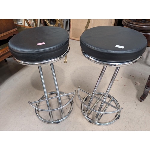 1052 - A pair of mid 20th Century style Italian made chrome and leather bar stools.