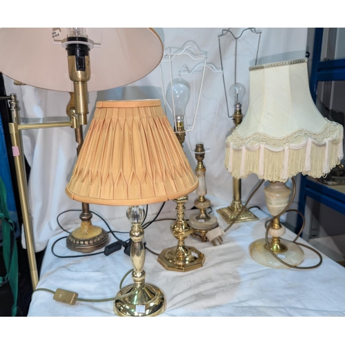 15 - An adjustable reading  lamp and various brass table lamps.