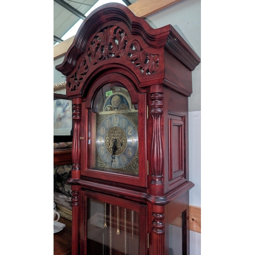 82 - A modern reproduction long case clock with classical gilt style dial.