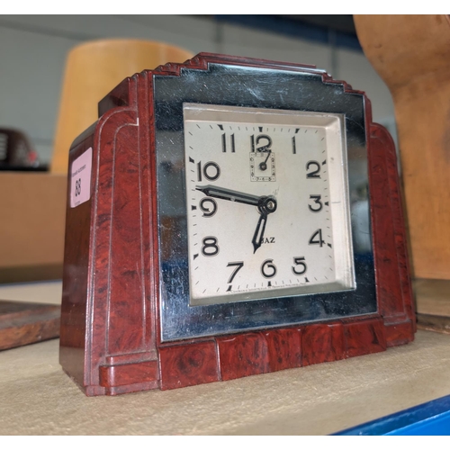 88 - An Art Deco clock by JAZ in chrome mounted bakelite case.