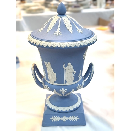 519 - A Wedgwood lidded urn in Jasperware blue, traditional decoration, height 29cm approx. limited certif... 