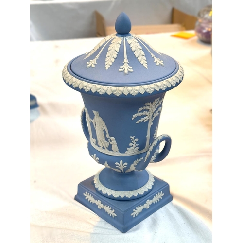 519 - A Wedgwood lidded urn in Jasperware blue, traditional decoration, height 29cm approx. limited certif... 