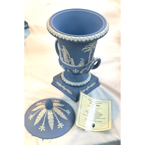 519 - A Wedgwood lidded urn in Jasperware blue, traditional decoration, height 29cm approx. limited certif... 