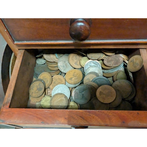 220 - A coin collection in four drawer mahogany collecting cabinet.