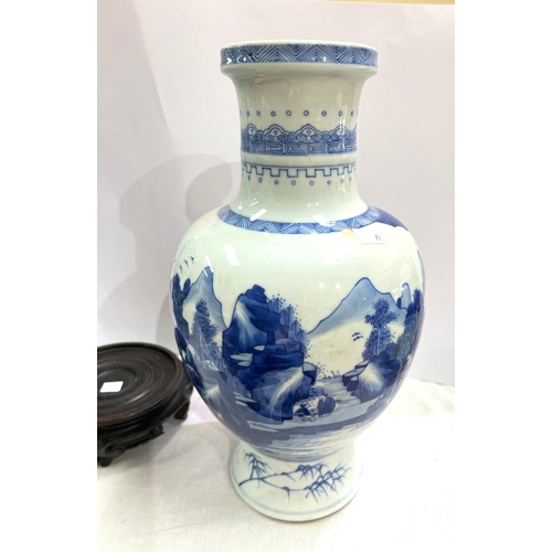 420A - A Chinese blue and white bulbous vase with mountainous scenes and geometric designs height 36cm with... 