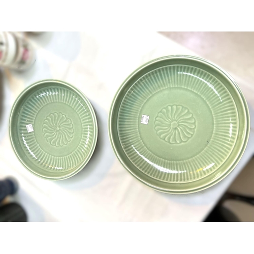 420D - Two Chinese celadon dishes, both with 6 character marks to bases, chrysanthemum decoration to centre... 