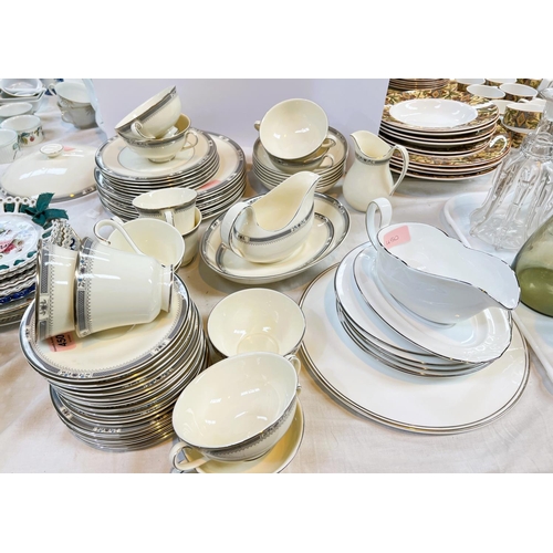 450 - A Royal Doulton 'Melissa' dinner service, approximately 55 pieces and other silver rim items.