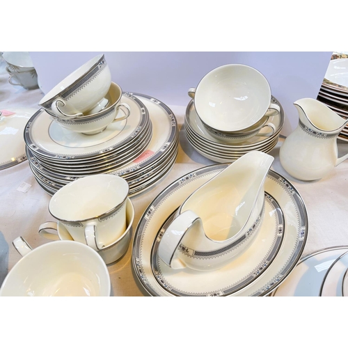 450 - A Royal Doulton 'Melissa' dinner service, approximately 55 pieces and other silver rim items.