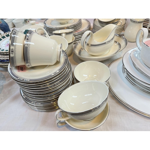 450 - A Royal Doulton 'Melissa' dinner service, approximately 55 pieces and other silver rim items.