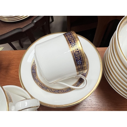 488 - A large Royal Doulton Harrow dinner and tea service.