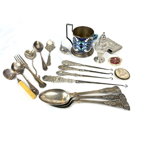 716A - A selection of white metal items including a Russian silver enamelled tea glass holder