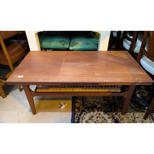 1027 - A mid 20th Danish designer Trioh teak coffee table with draw leaf