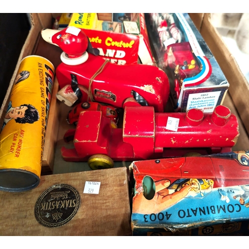 329 - A selection of vintage toys - some in original boxes.