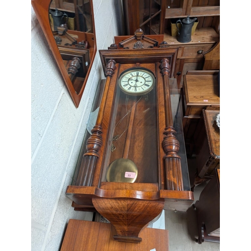 33 - A mahogany cased double weight driven Vienna wall clock.