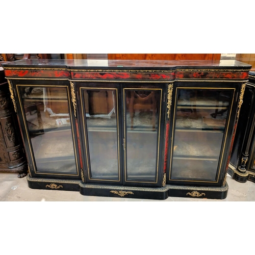 983 - A large 19th Century ebonised credenza with boule work, brass fittings, four glazed doors with brass... 