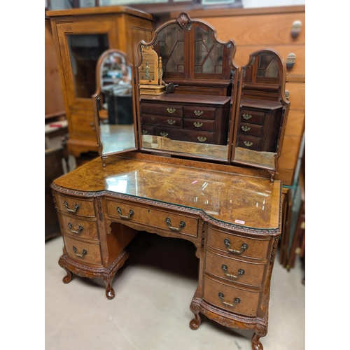 1037 - A Burr walnut Epstein style dressing table/desk with triple mirror with 7 drawers with carved detail... 