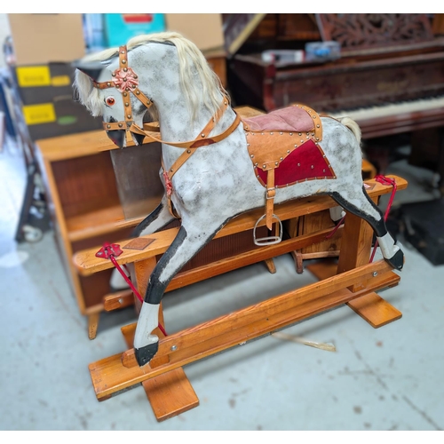 326 - A Victorian style rocking horse, dapple grey with real hair mane and tail, leather reins, stirrups e... 