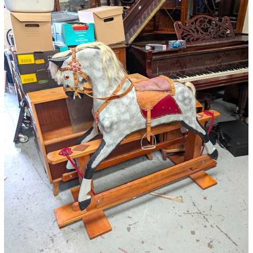 326 - A Victorian style rocking horse, dapple grey with real hair mane and tail, leather reins, stirrups e... 