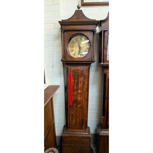 953 - An 18th Century oak longcase clock, the hood with pagoda pediment and turned pillars, full length do... 