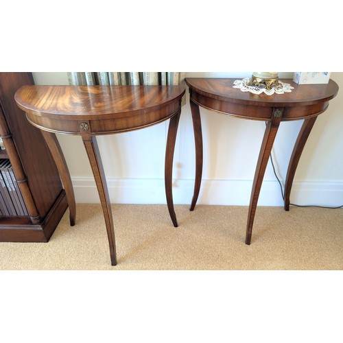 863 - A pair of  mahogany reproduction demi-lune side tables in the 19th century manner, length 61cm.