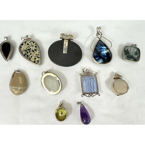 791 - A selection of pendants set with natural stones including labradorite, haematite, amethyst, granite ... 