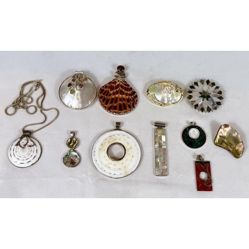 794 - A selection of pendants set with shell - abalone, mother of pearl, etc