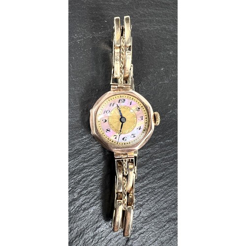 656 - A lady's vintage wristwatch with 9ct gold case and strap - gross weight 23gm.