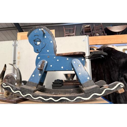 323 - A small vintage blue painted rocking horse with metal foot rests, height 63cm