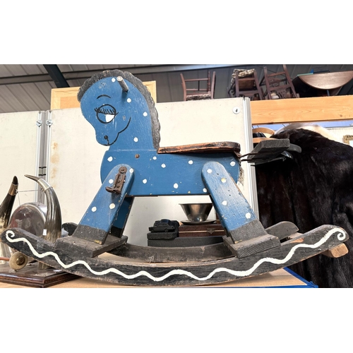 323 - A small vintage blue painted rocking horse with metal foot rests, height 63cm