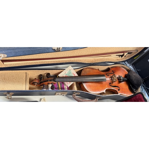 386 - An early 20th century violin with two piece back, interior label, body length 37.5cm, incised decora... 