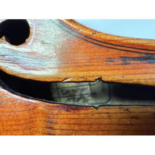 386 - An early 20th century violin with two piece back, interior label, body length 37.5cm, incised decora... 