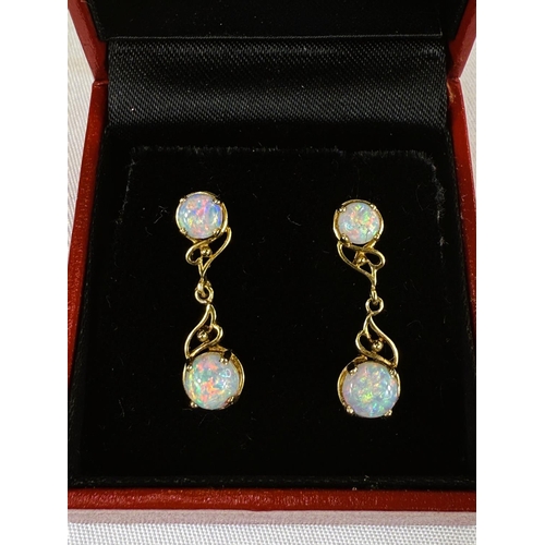 737B - A pair of opal earrings, stamped 585.