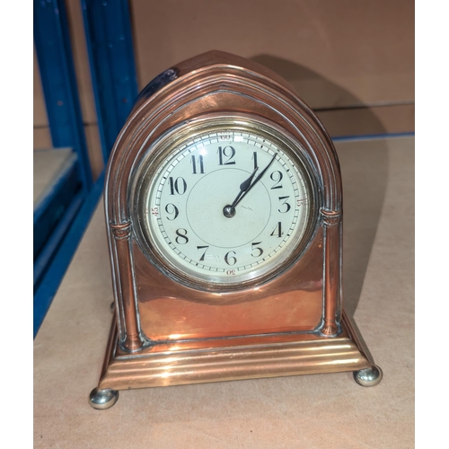 125 - An early 20th Century copper mantle clock.