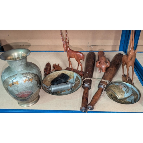 126 - A pair of Indian clubs, metalware, carved animals etc.