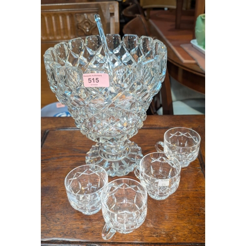 515 - A large cut glass punch bowl and glasses and a selection of wine and brandy glasses.