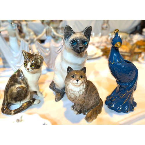 493 - Two ceramic Winstanley cats with glass eyes, No4 and No7, a Beswick cat etc.