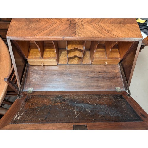 1012 - A 1930's parque figure work fall front bureau.