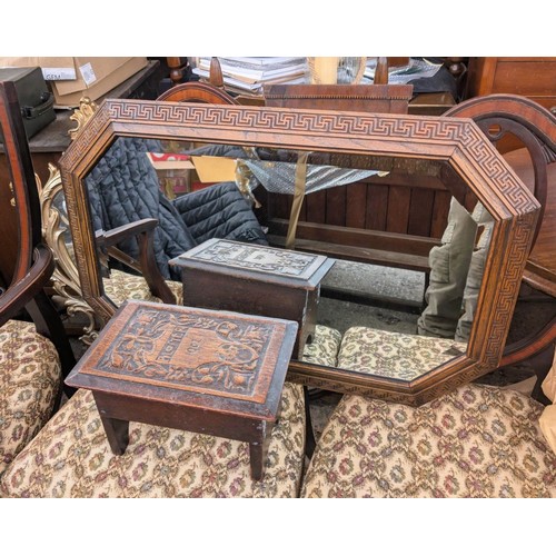 1013 - A 1930's canted oak wall mirror; a small carved oak stool.