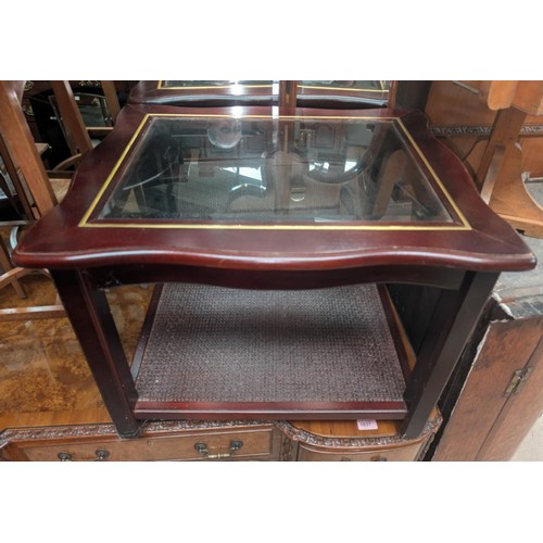 1044 - A mahogany floor standing corner cupboard with single door and a similar glass top table