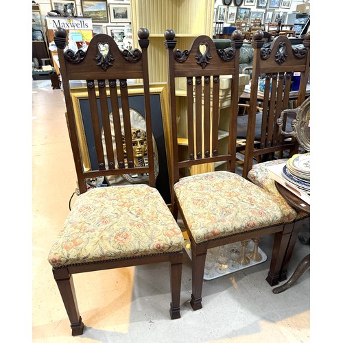 895A - A set of mahogany high back dining chairs with carved detail