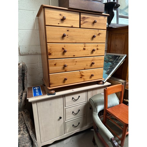 930A - A limed oak effect sideboard, length 115cm, a pine chest of drawers, 83cm and a four drawer cabinet.