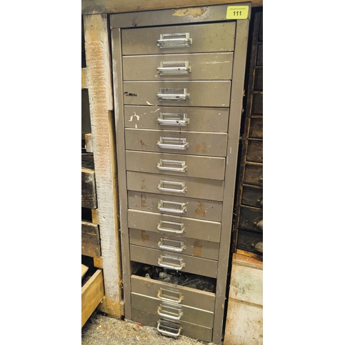 111 - A cabinet containing vintage taps, dies, chisels, files, Stanley knives etc (one drawer missing, one... 