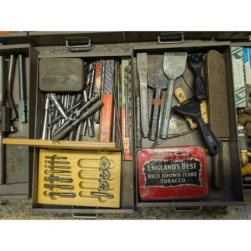 111 - A cabinet containing vintage taps, dies, chisels, files, Stanley knives etc (one drawer missing, one... 