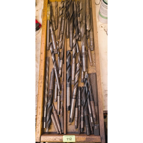 112 - A collection of various large and smaller drill bits, various types and forms.