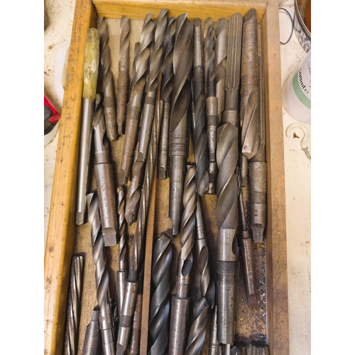 112 - A collection of various large and smaller drill bits, various types and forms.