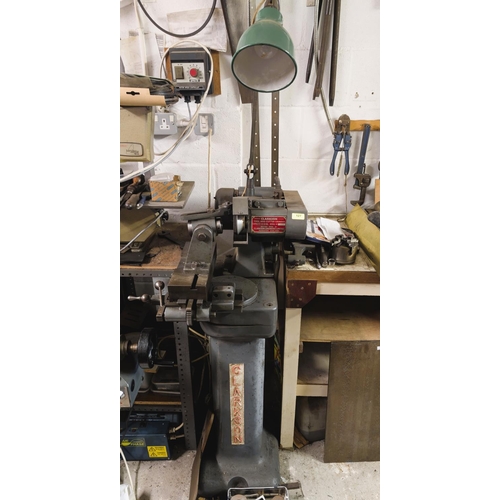 127 - A Clarkson tool and cutter grinder, capacity 12x6 dia. serial No. 1376, with angle lamp and accessor... 