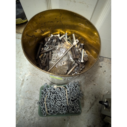 131 - A bucket of bolts and a chain, other nuts and bolts.