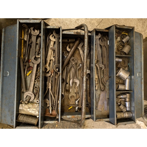 136 - A vintage tool box containing wrenches and tools.