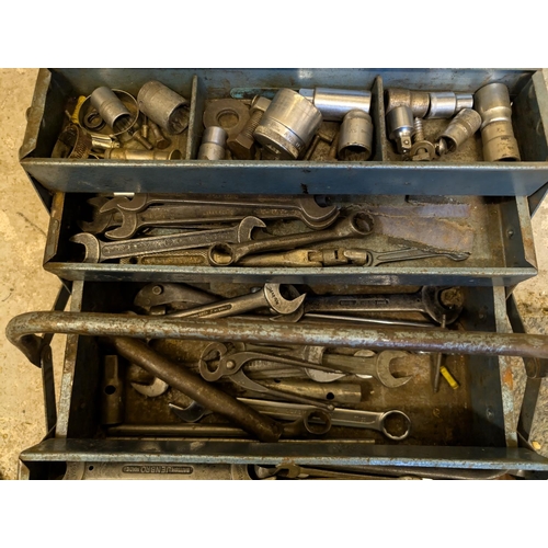 136 - A vintage tool box containing wrenches and tools.